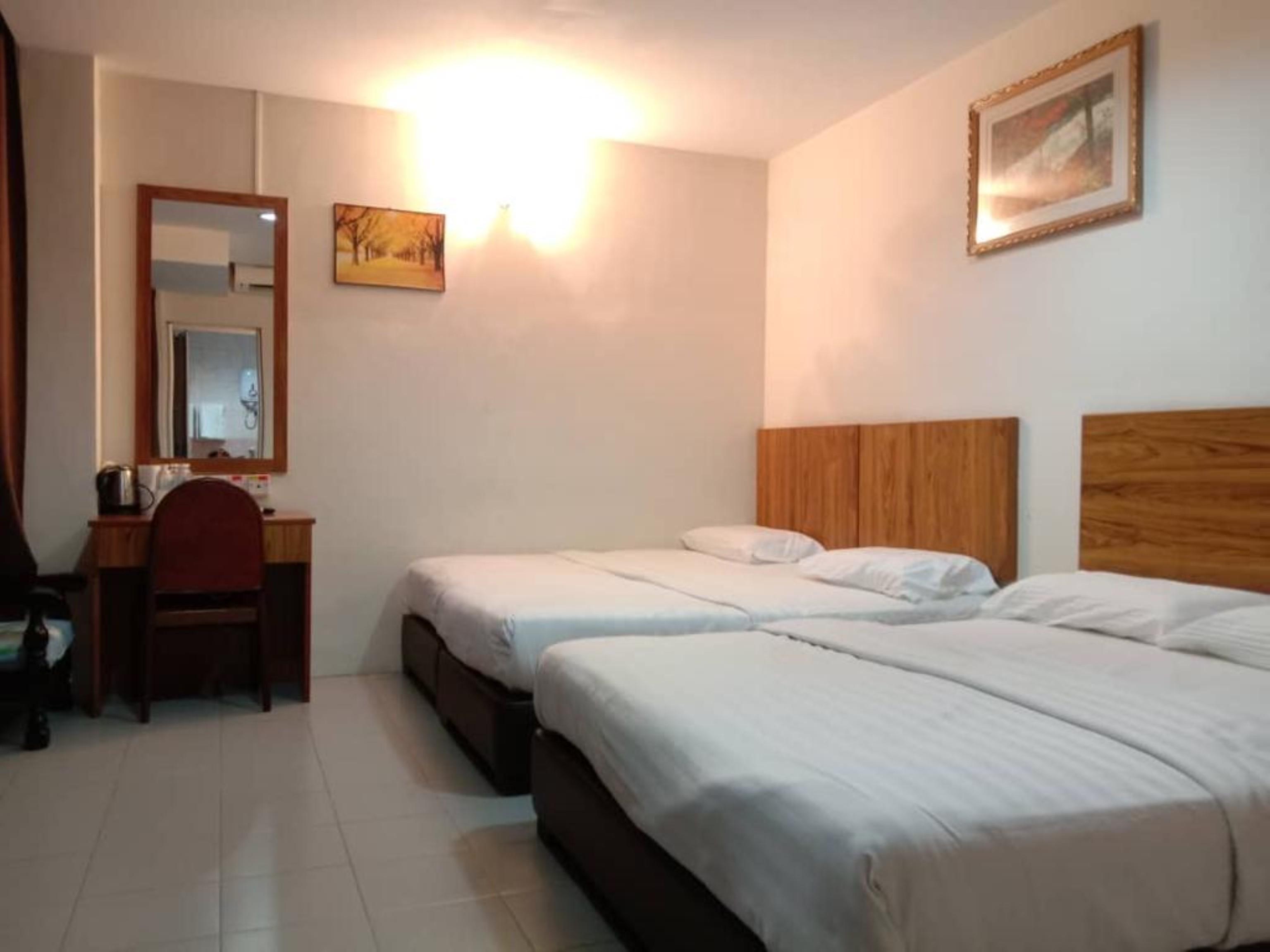 Oyo 89877 Sun Triang Hotel Kampong Kerayong Eksteriør billede